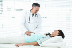 hospital-doctor-checks-pregant-patient
