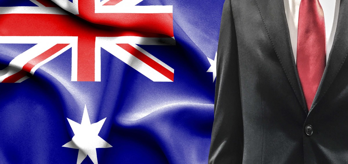 black suit-red tie- australian flag-goverment official