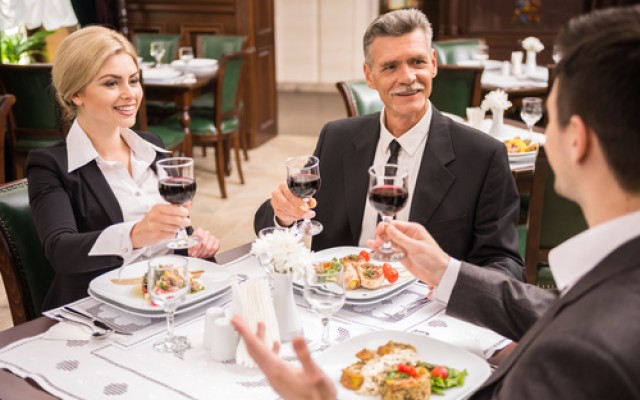 Group of successful business people celebrating a great deal agreement.
