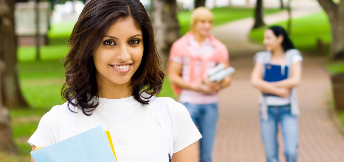college_student_smiling_saving_money_studying_abroad_tips