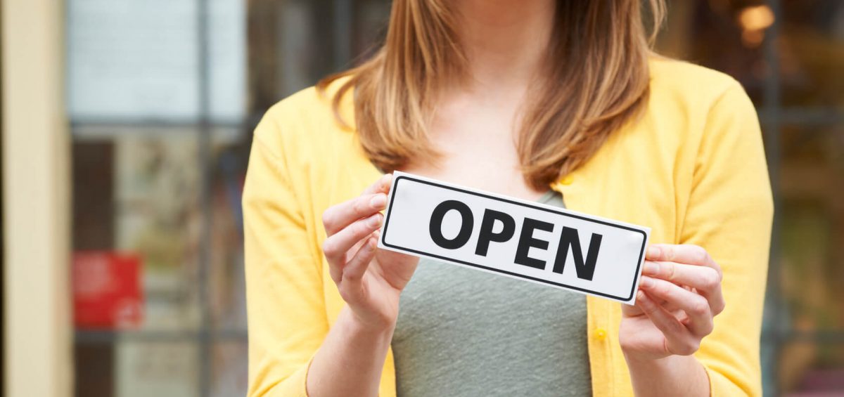 7-more-things-to-remember-when-starting-a-small-business-in-australia-girl-with-open-sign-business